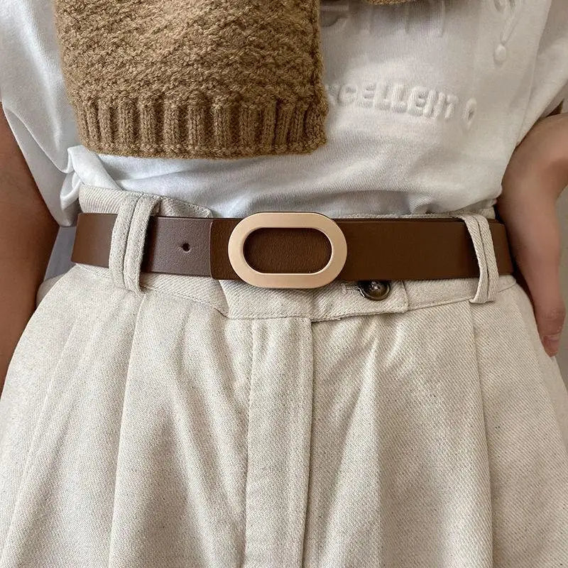 Brown leather belt with an oval gold buckle for stylish men’s accessories