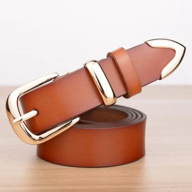 Women’s leather belt with gold buckle, stylish accessory for denim outfits