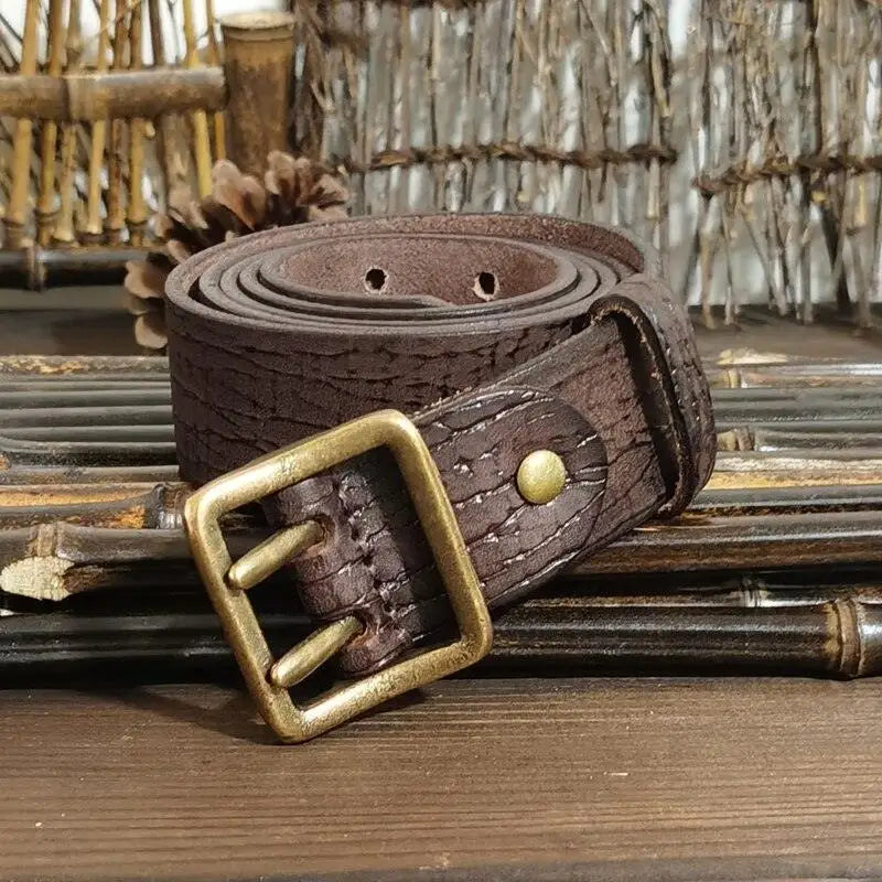 Set of four brown leather belts with brass buckles for versatile style options