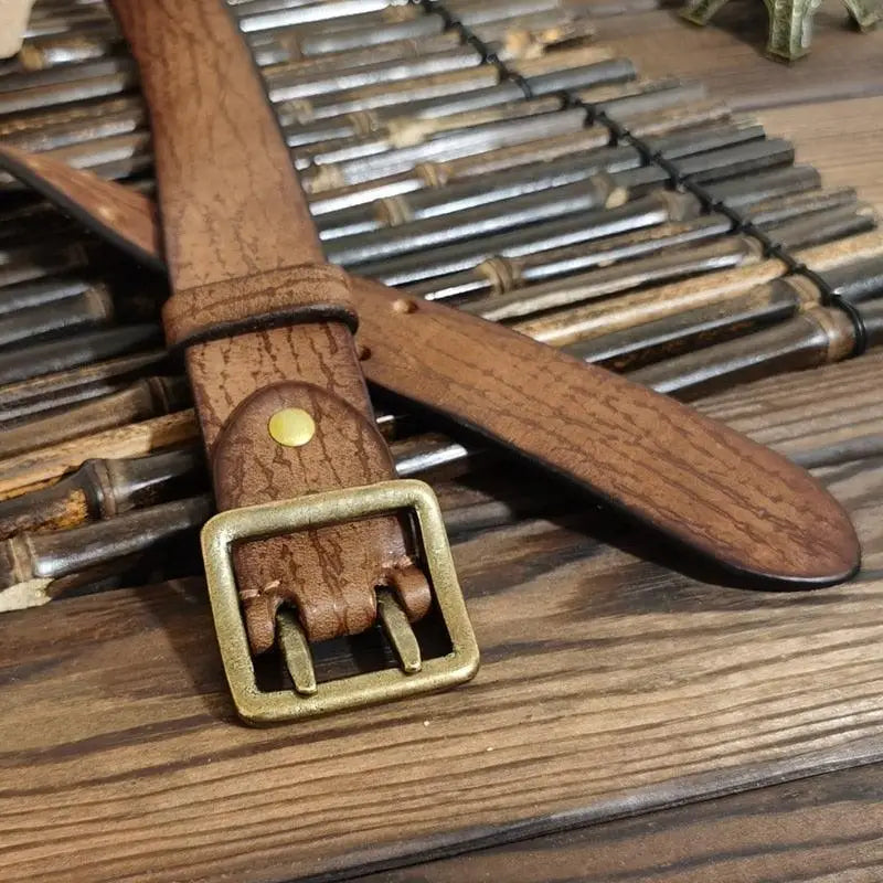 Brown leather belt with a brass buckle from the Set of Four Leather Belts collection