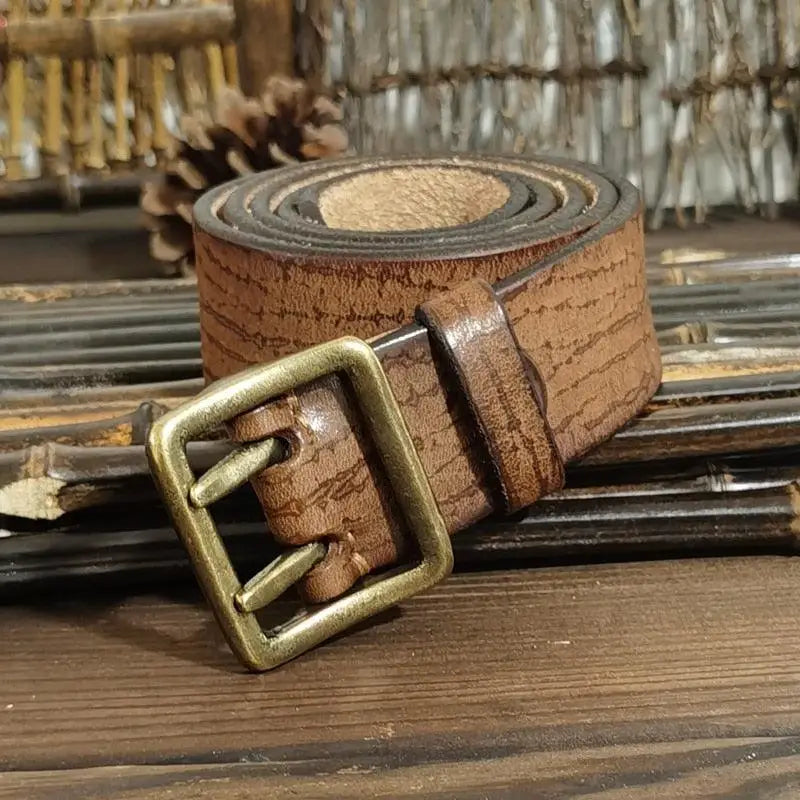 Set of four brown leather belts with brass buckles displayed in the product image