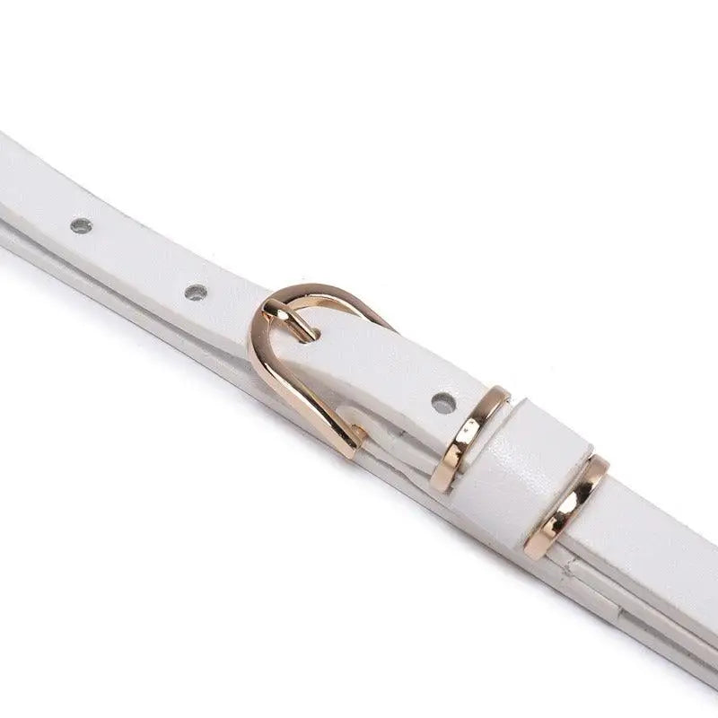 White leather belt with gold buckle from Roxane Leather subtlety complements ribbed beige sweater