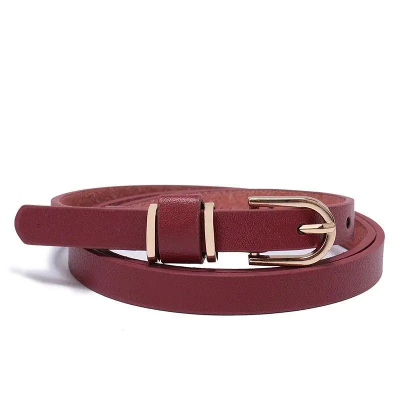 Roxane leather belt with gold buckle complementing ribbed beige choker-neck sweater