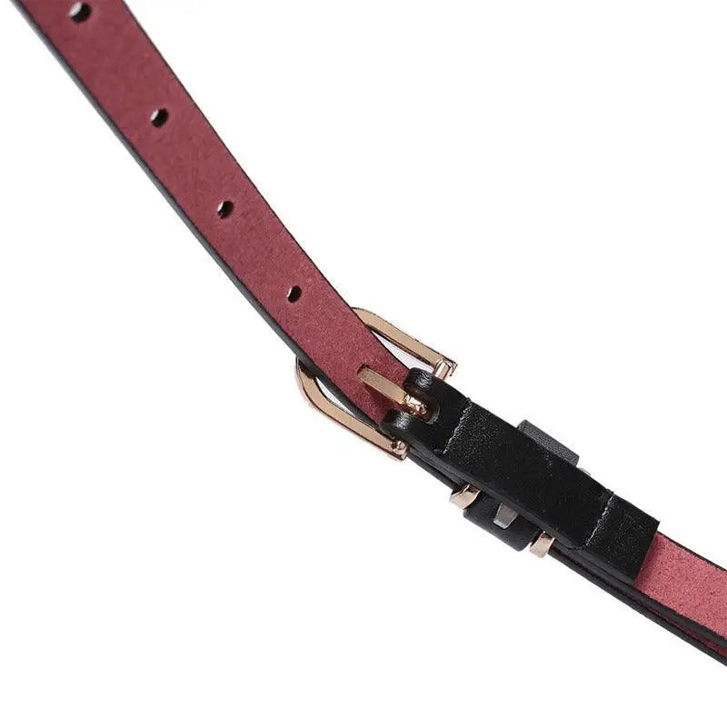 Roxane leather belt with black buckle complements beige choker-neck sweater fashion accessory