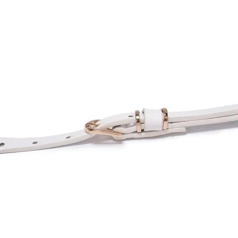 White leather belt with gold buckle from Roxane Leather complementing ribbed beige choker-neck sweater