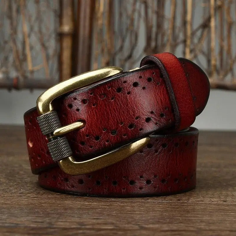 Burgundy leather belt with brass buckle and decorative perforations for stylish wear