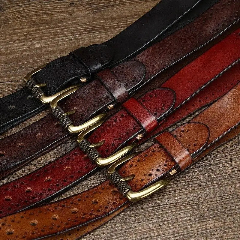 Leather belts with decorative perforations in brown and burgundy colors