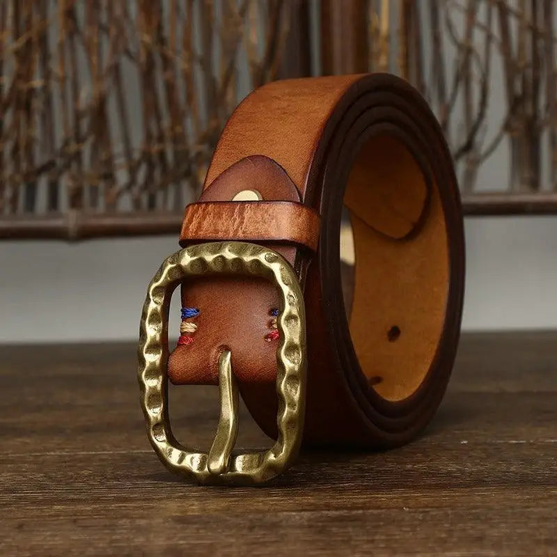 Leather belt with hammered metal buckle from the Tahirah Model, part of assorted leather belts collection