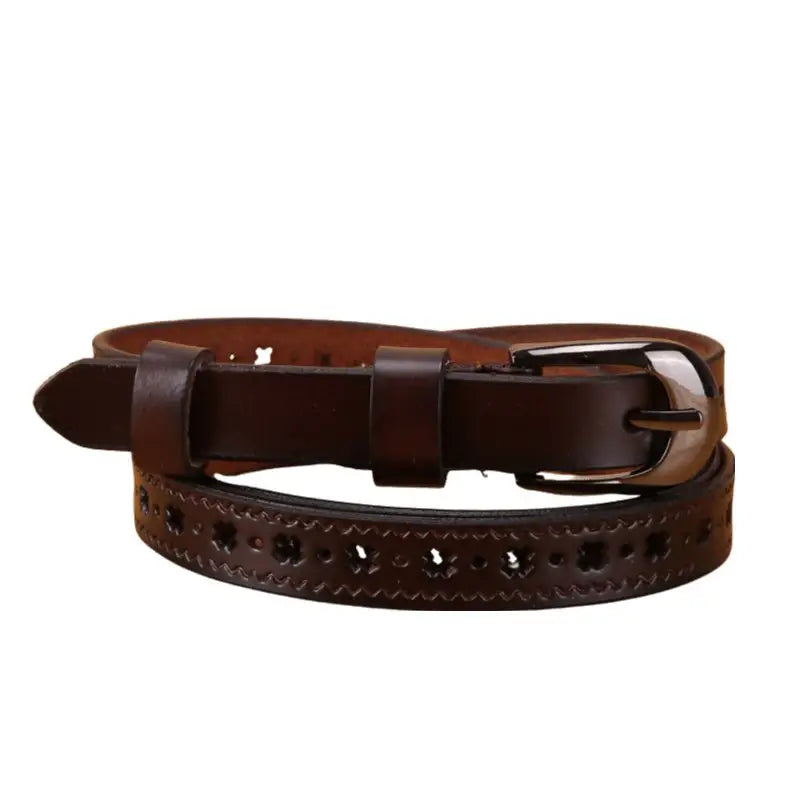 Brown leather belt with decorative cutouts and adjustable buckle on display