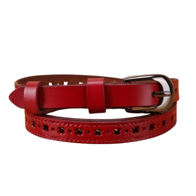 Red leather belt with decorative cutouts and adjustable buckle options displayed