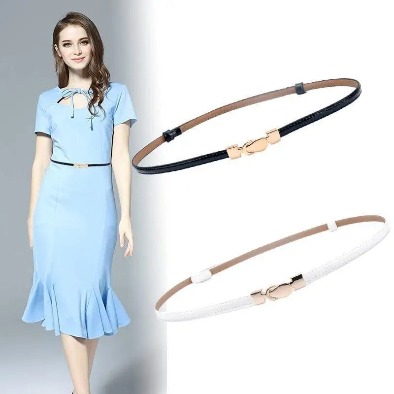 Woman wearing a blue dress with a thuasca leather belt and thin belts for an elegant look