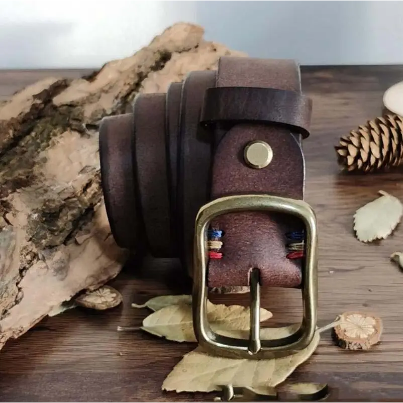 Assorted Brown Leather Belts with Brass Buckles, featuring a rolled brown leather belt with brass buckle