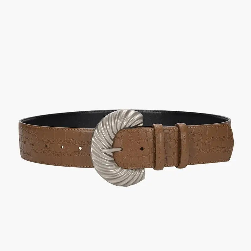 Leather belt with silver buckle displayed with Sherpa vest accessory in product image