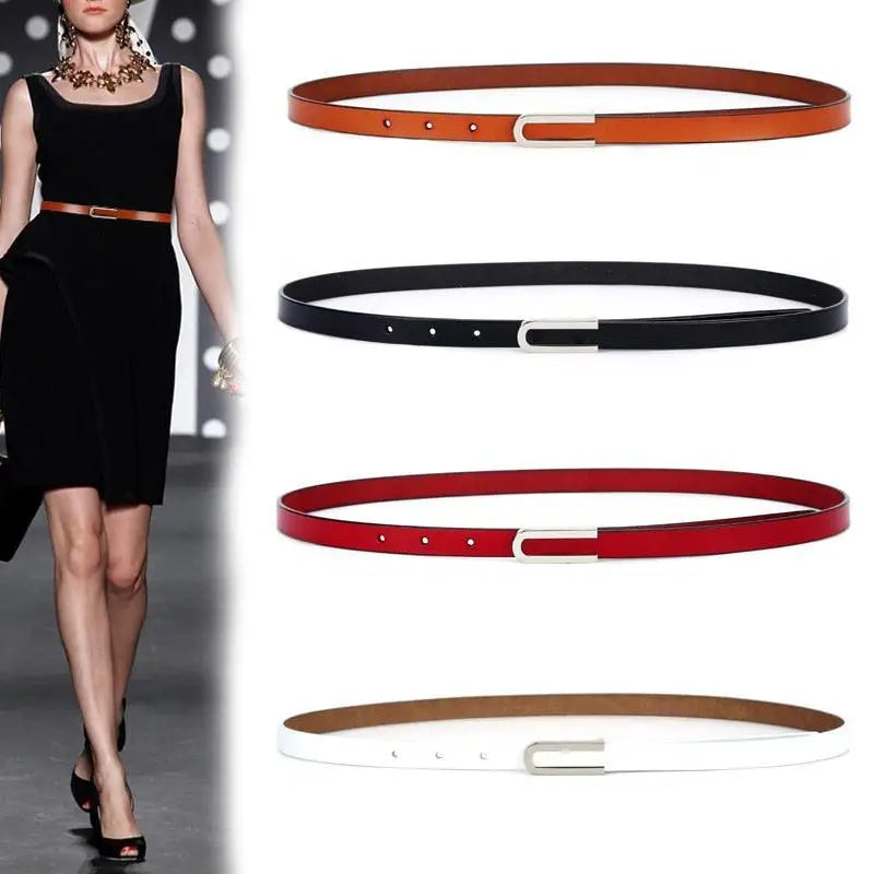 Woman wearing a black dress with colorful leather belts featuring silver buckles