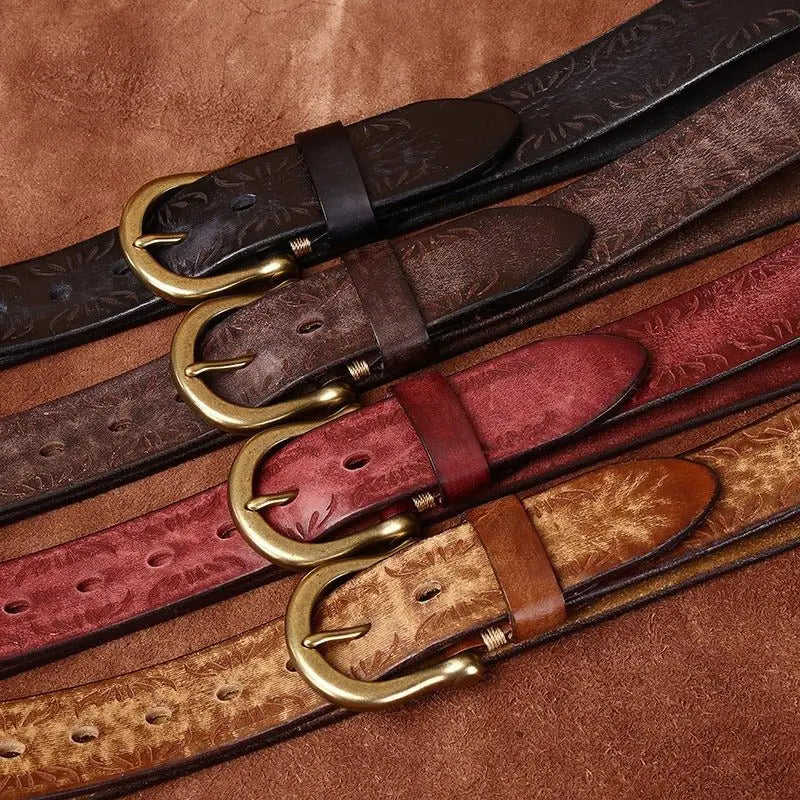 Four Meera Model Leather Belts with Brass and Gold Buckles displayed