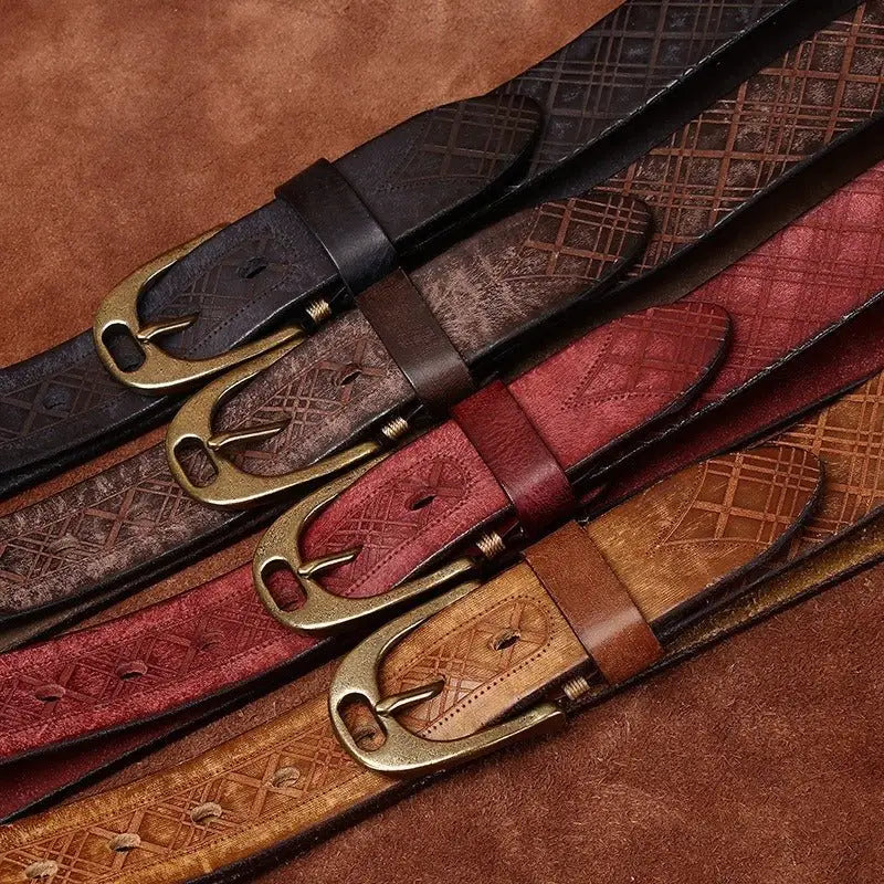 Assorted embossed leather belts with brass buckles displayed prominently in the product image