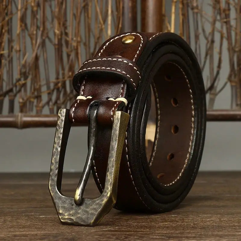 Brown leather belt featuring a hammered metal buckle from Leather Belts with Decorative Metal Buckles