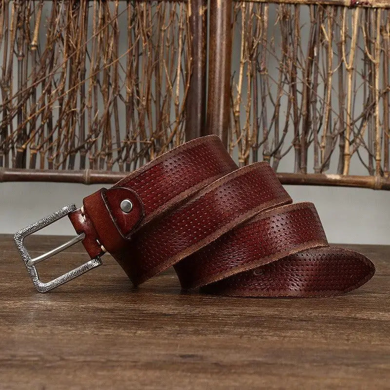 Perforated brown leather belt with silver buckle displayed in Brown Leather Belt with Silver Buckle product image