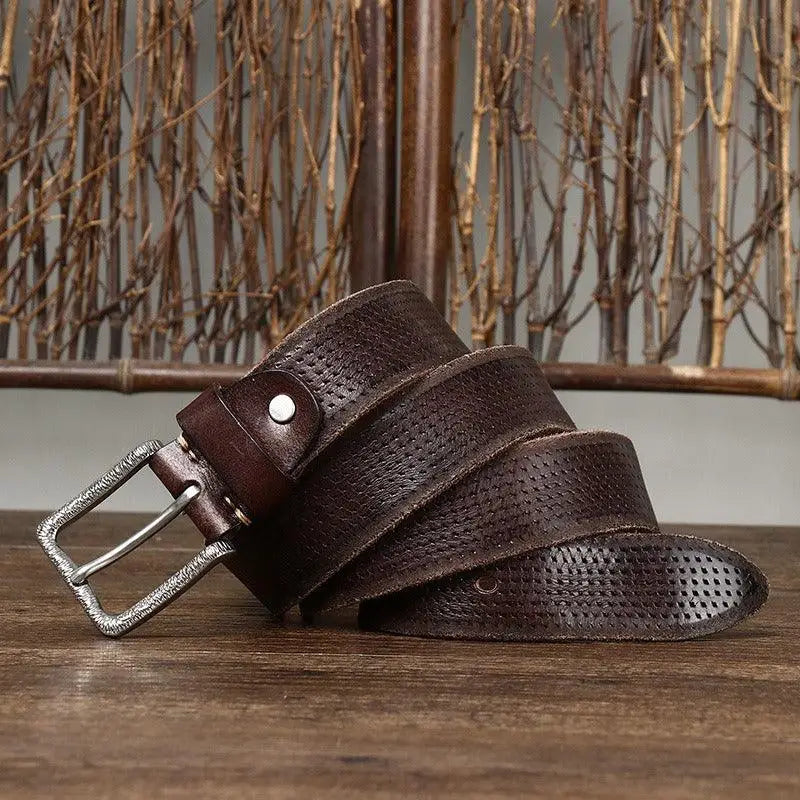 Perforated brown leather belt with silver buckle displayed in product named Brown Leather Belt with Silver Buckle