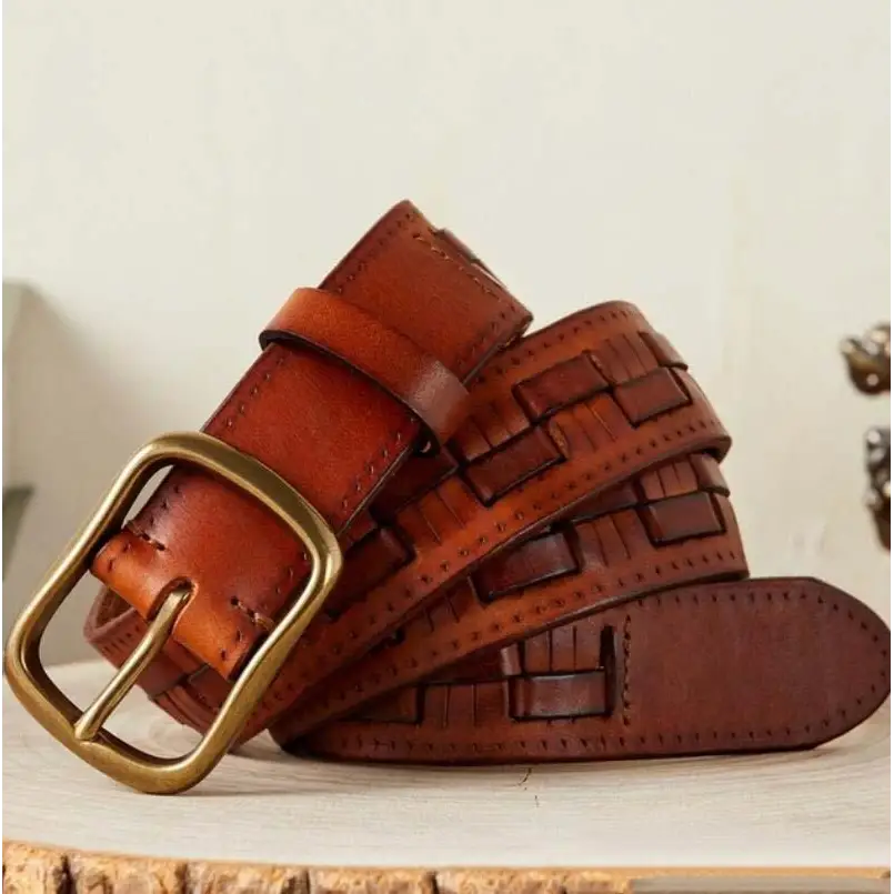 Brown leather belt with brass buckle paired with Two-Tone Denim Jeans in product display