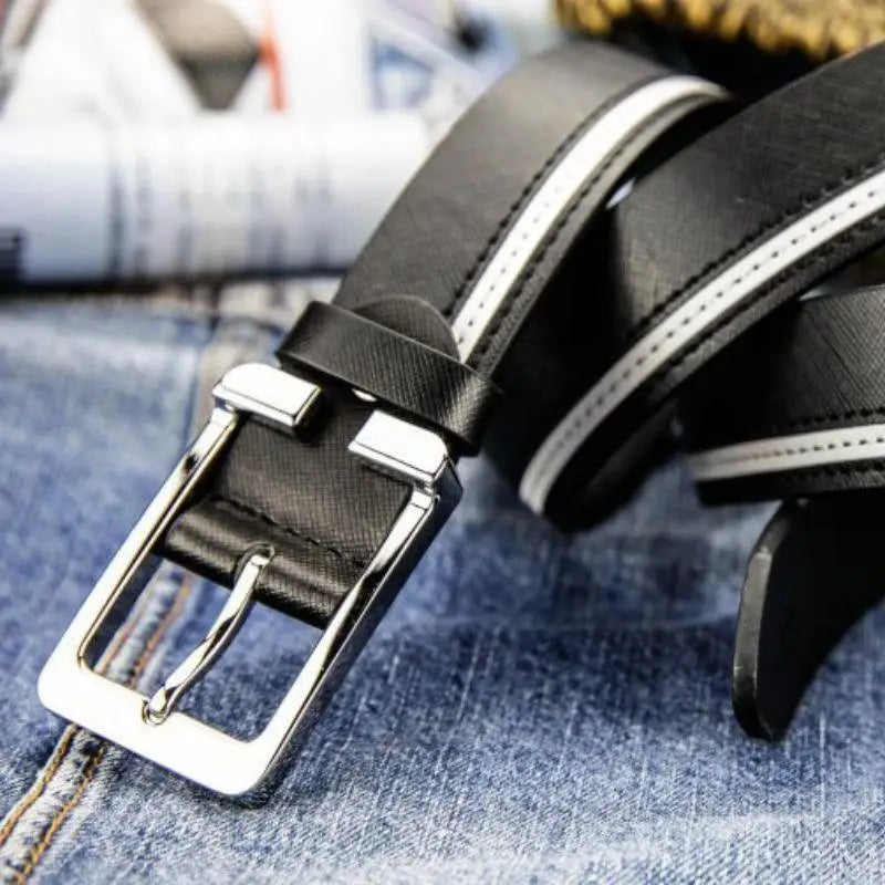 Black leather belt with silver buckle, a versatile accessory for stylish outfits