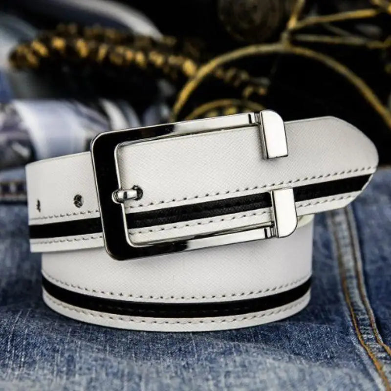 White belt with black stripes and silver buckle shows versatile accessory style for various outfits