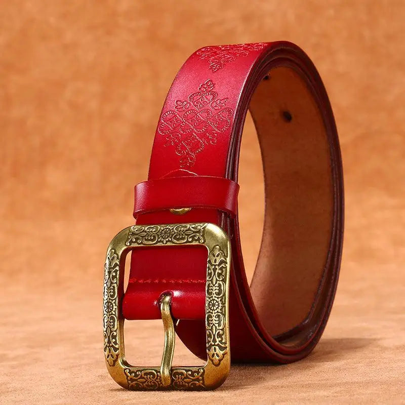Red leather belt with ornate buckle from the Itzel Leather Belt Collection