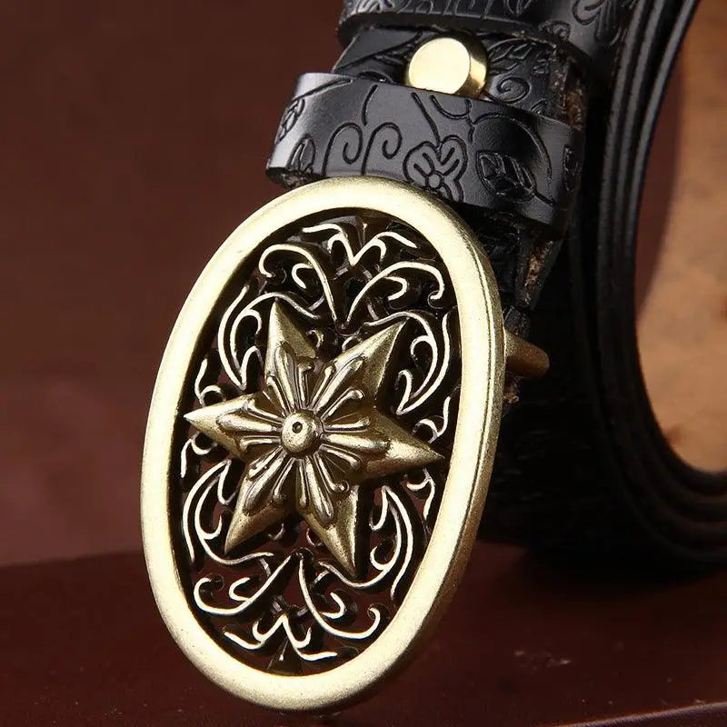 Ornate gold star buckle on Sanaa Leather Belt with floral pattern and leather belt design