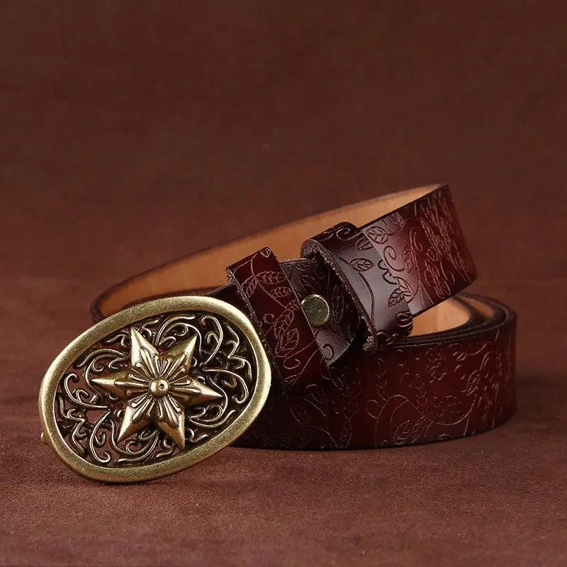 Embossed Sanaa Leather Belt with ornate buckle featuring floral pattern and gold star detail
