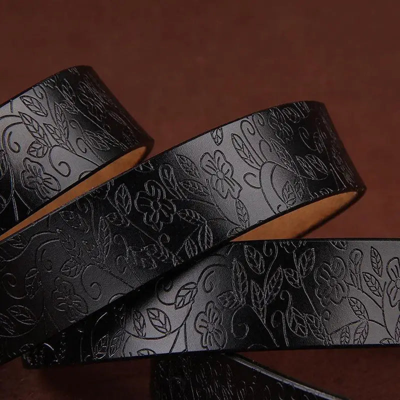 Black leather floral belt with ornate gold star buckle from Sanaa Leather Belt collection