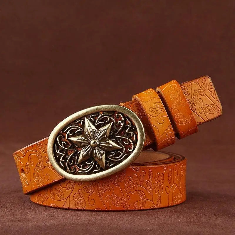 Embossed Sanaa Leather Belt with ornate gold star buckle and floral pattern