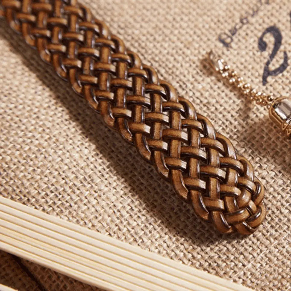 Brown woven leather belt from Kara Braided Leather collection with tassel accessory
