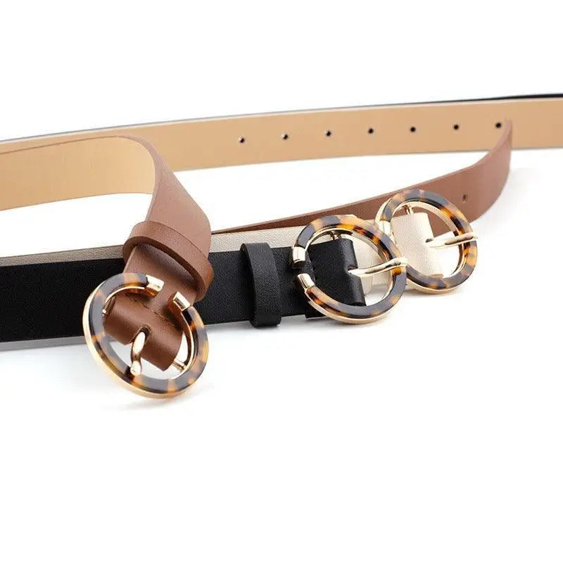 Set of three stylish faux leather and leather belts with tortoise-shell buckles