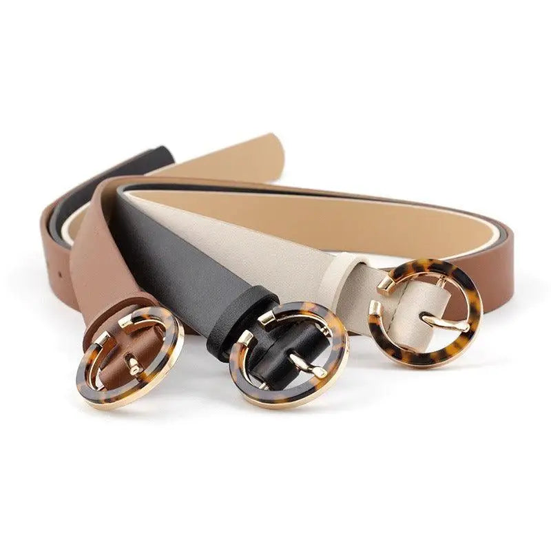 Set of three stylish faux leather and leather belts for fashion accessories