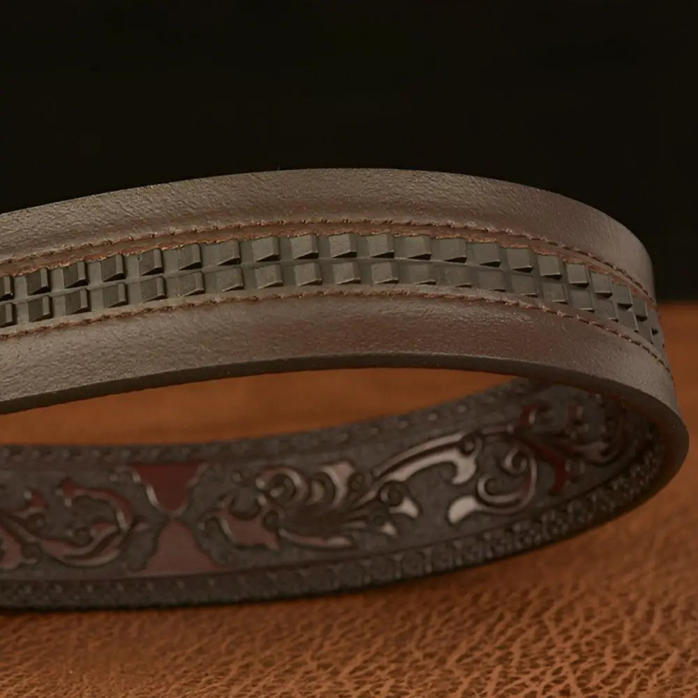 Embossed brown leather belt with decorative patterns and eagle buckle for stylish wear