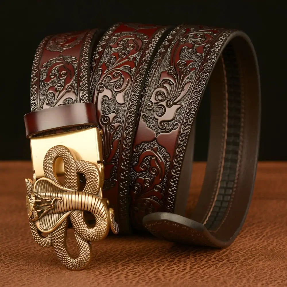 Embossed leather spirit animal belt featuring a cobra snake buckle and intricate animal design