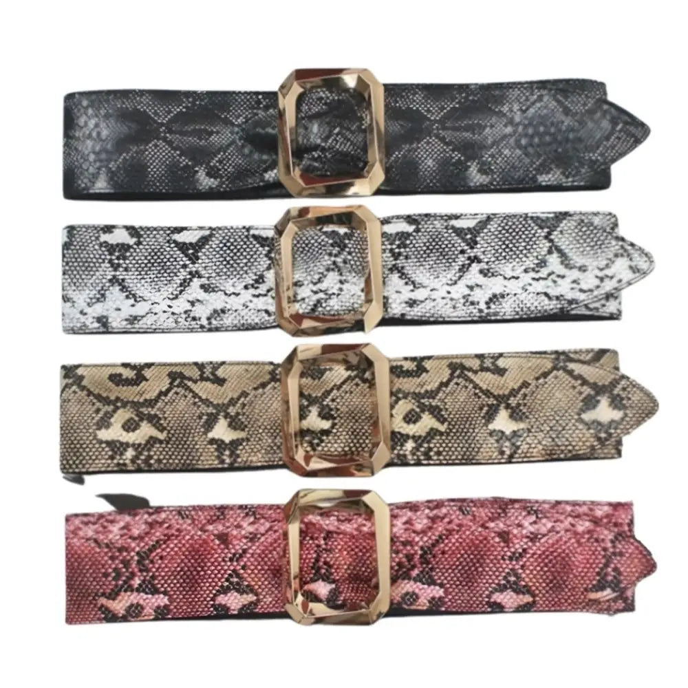 Four snakeskin-patterned leopard print belts with gem-like gold buckles for stylish black dresses