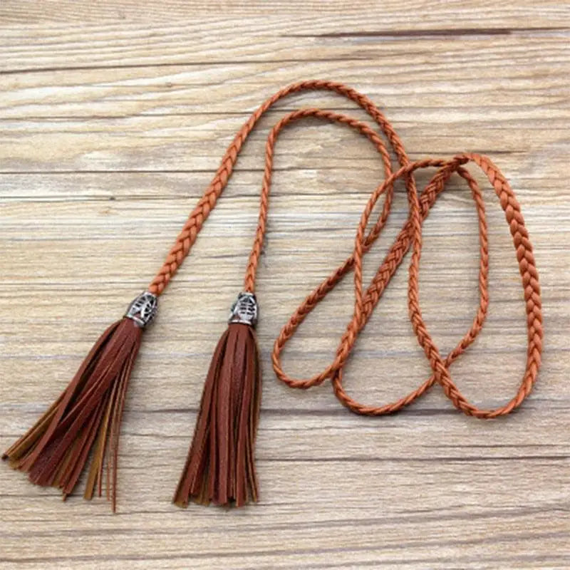 Braided brown tumunia model tie belt with tassel detailing for women