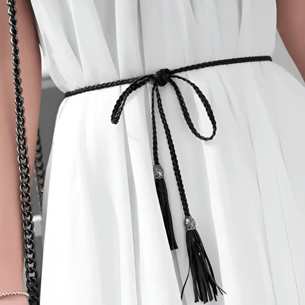 Braided black tumunia model tie belt with tassel detailing for women