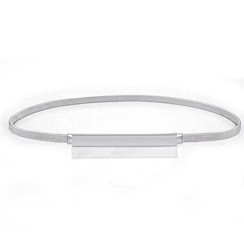 Silver metal belt from Dhoxia Slim Belt collection with gold-toned buckle for elegant fit