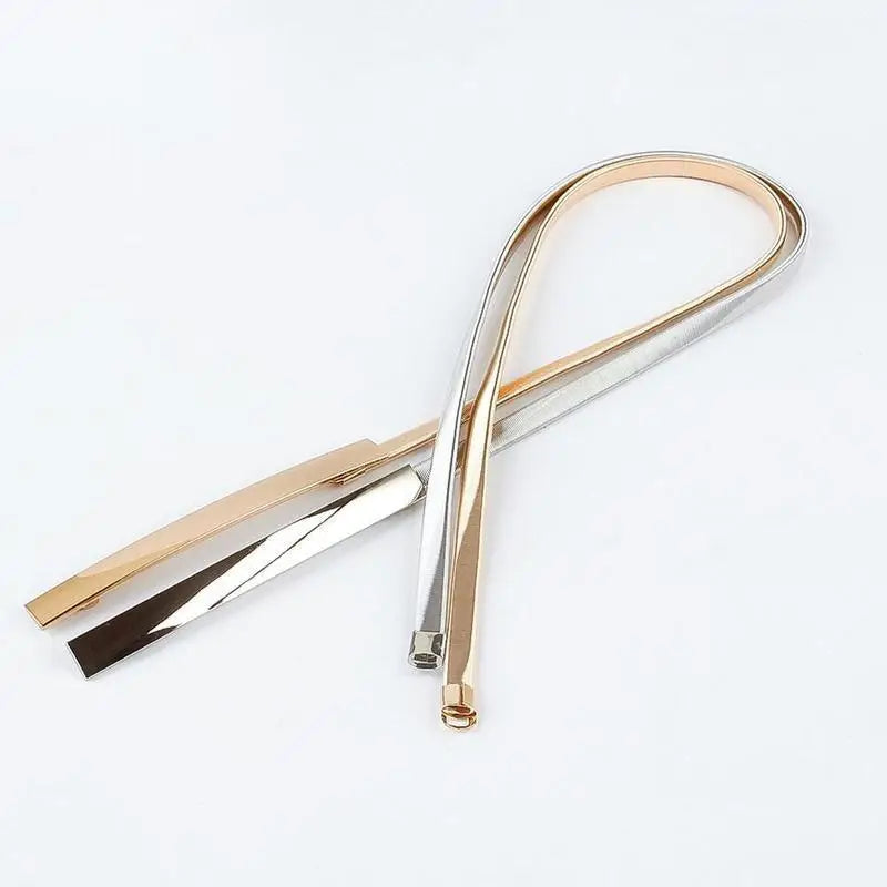 Gold and silver metal belts for a stylish fit, part of the Dhoxia Slim Belt collection