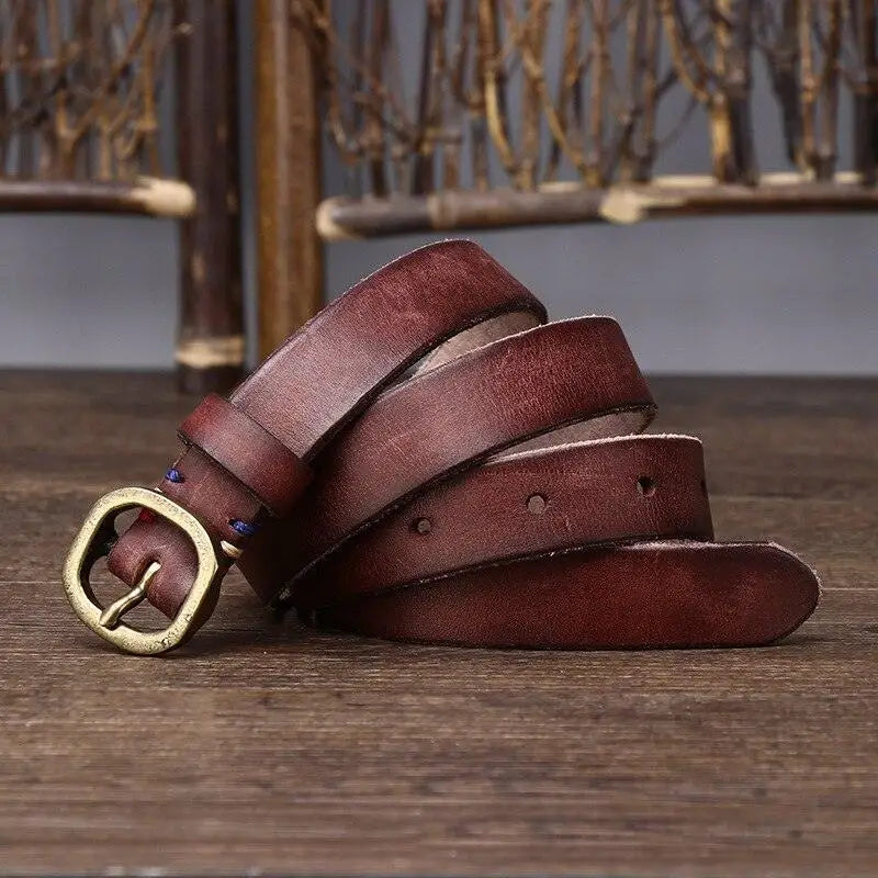 Assorted Green Leather Belts with Brass Buckles featuring a rolled brown leather belt with brass buckle