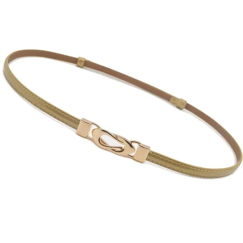 Black patent leather belt with a thin gold decorative buckle for elegant fashion accents