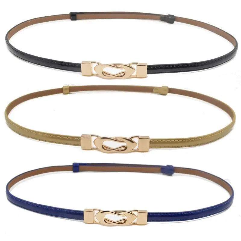 Three thin black patent leather belts with gold decorative buckles displayed in a product image