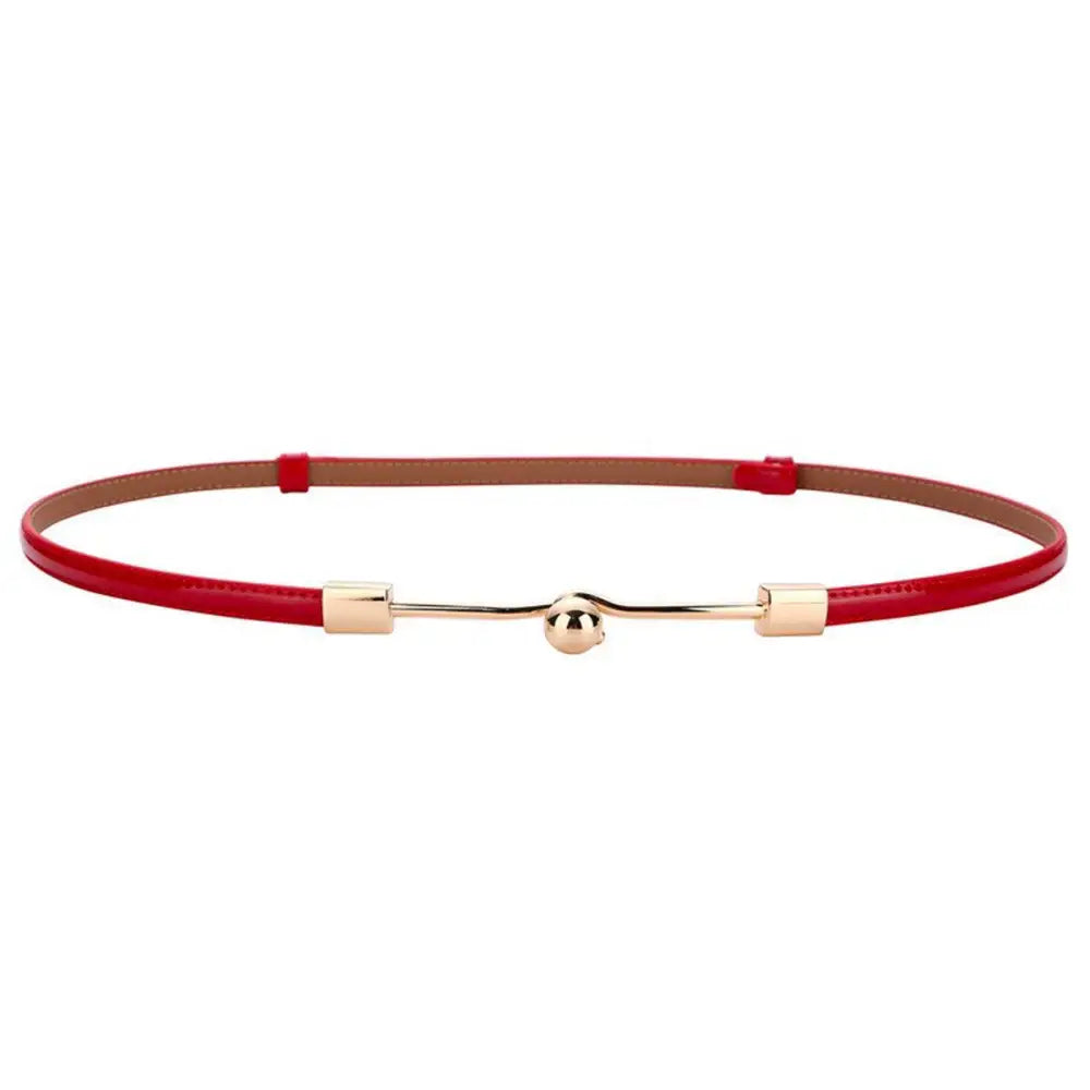 Red patent leather Wrona Belt with gold buckle showcasing subtle sophistication