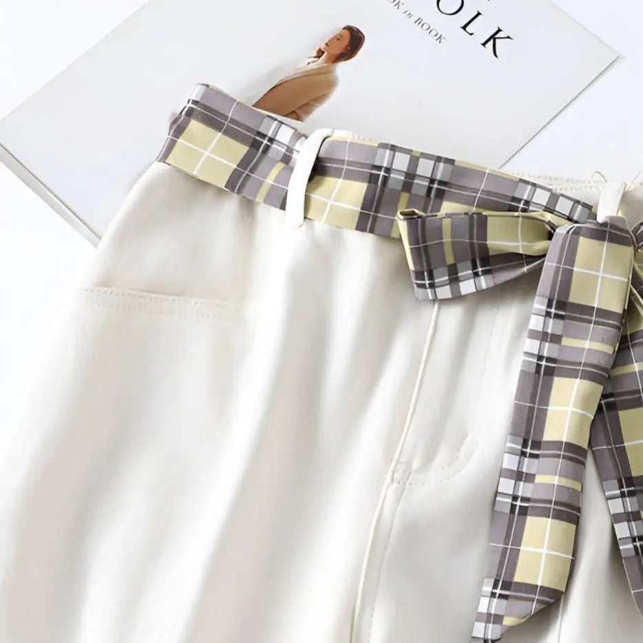 White shorts with plaid scarf belt and tie details for stylish summer wear