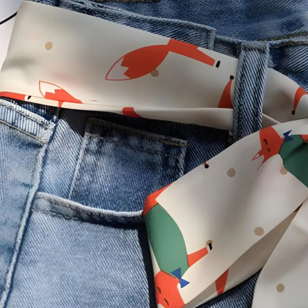 Denim jeans paired with a fox-patterned scarf from Fashionable Denim Outfits collection