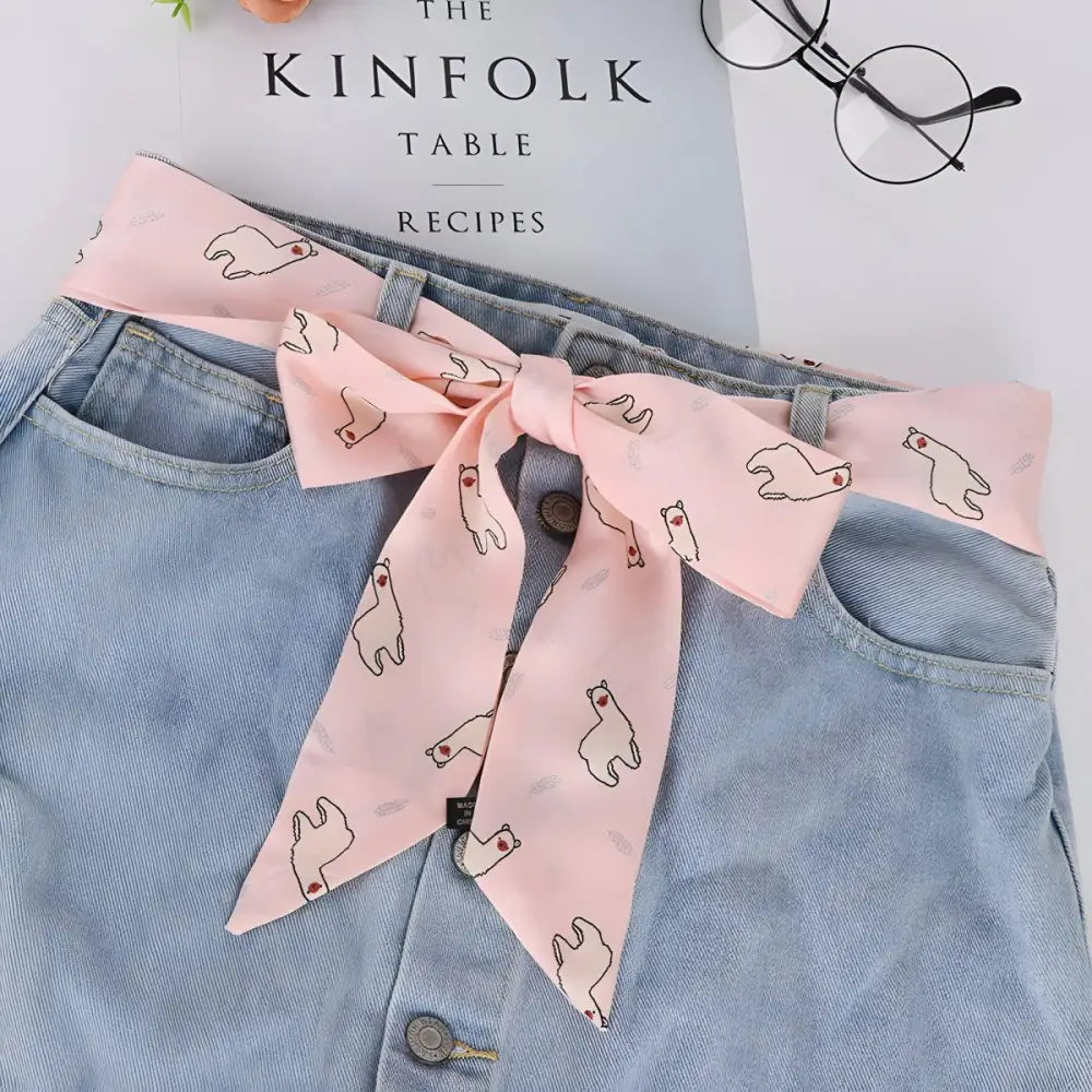Light blue denim skirt with South American alpaca-patterned scarf belt for a stylish look