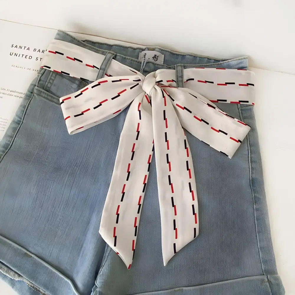 Lento Scarf Belt with Red and Black Dashes worn with casual denim shorts