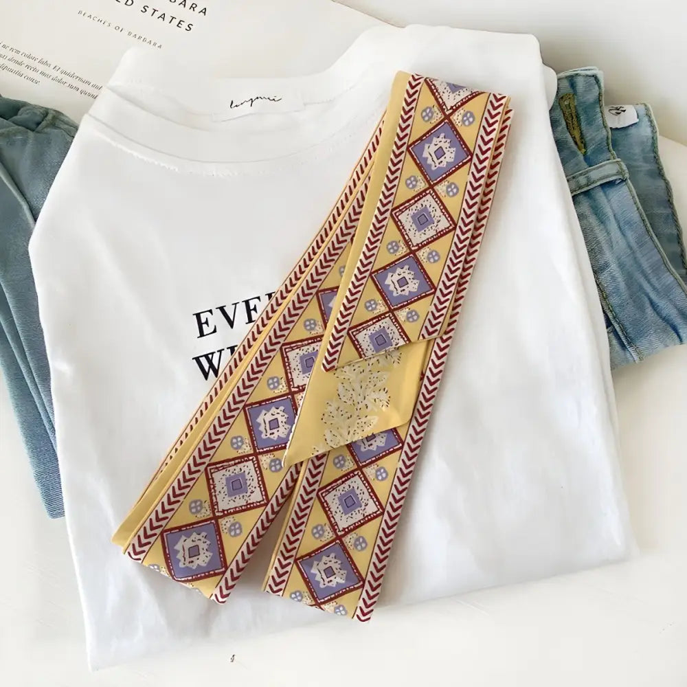 Patterned yellow scarf featuring a borra scarf belt for stylish accessorizing